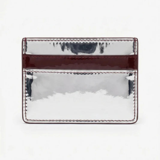 A rectangular metallic silver card holder with a glossy dark burgundy horizontal band and matching stitched edges, shown against a plain white background.